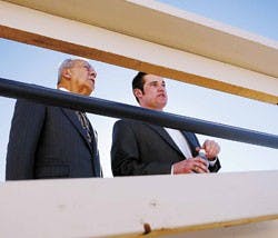 UNM presidential candidate Herman Lujan, left, and Kevin Stevenson, special assistant to the president, look at the Centennial Engineering Center construction site during Lujan's tour of campus Monday.