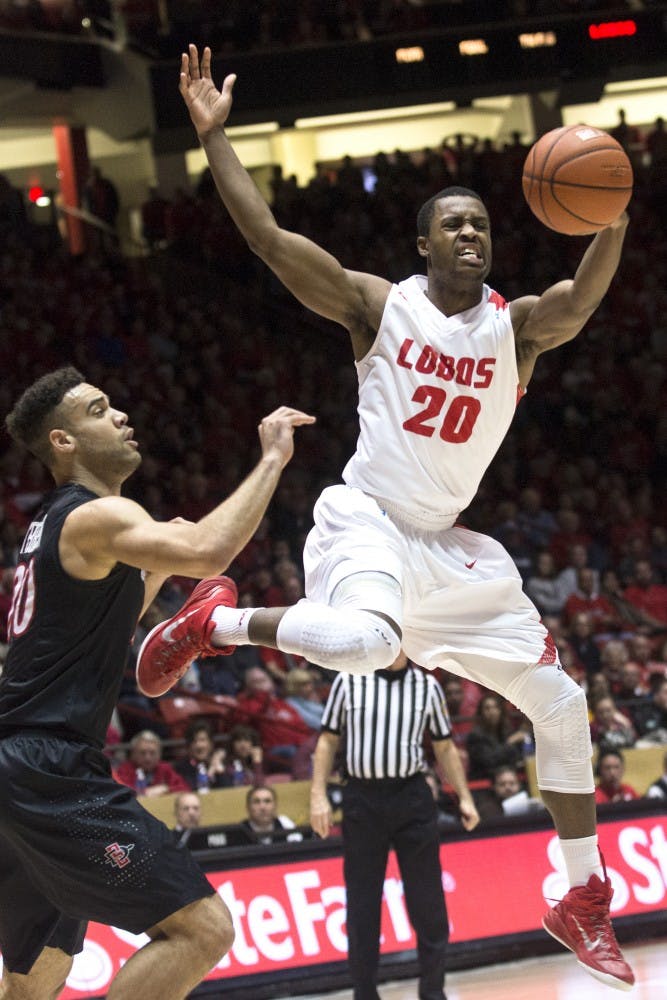 New Mexico guard Sam Logwood (20) attempts to keep the ball in the Lobos possession during Tuesdays game at WisePies Arena.