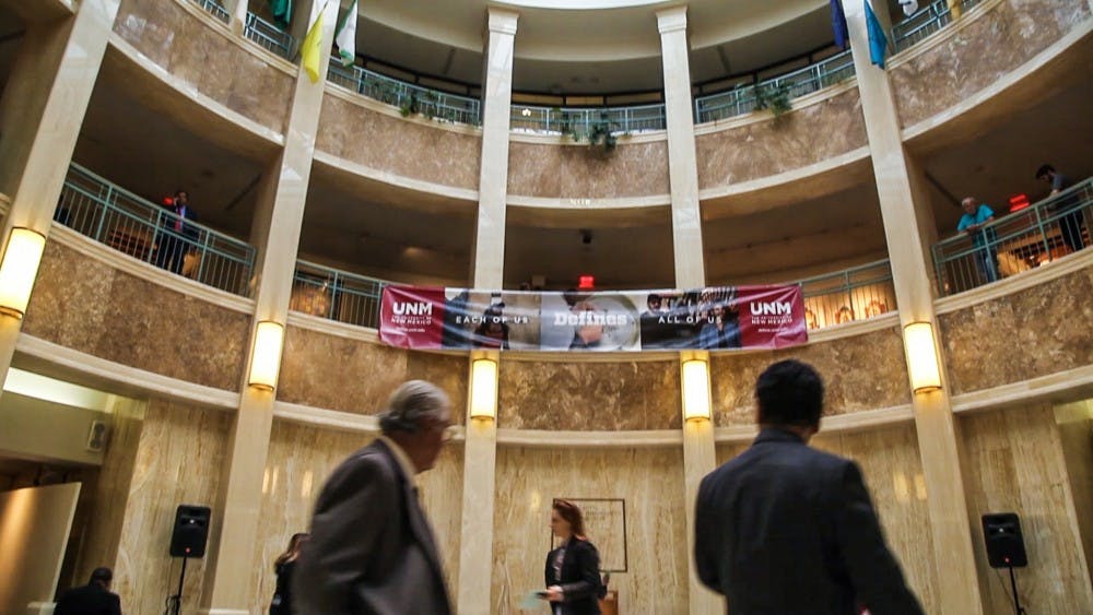 A UNM banner hangs in the rotunda of the New Mexico State Capitol during UNM Day in Santa Fe, New Mexico on Monday, Jan. 30, 2017. Members of nearly 30 UNM community organizations showcased their work to New Mexico state representatives and patrons of the state capitol building.