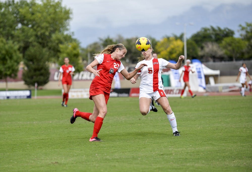 UNM midfielder Alyssa Coonrod headbutts a soccer ball on Oct. 10, 2015 against a University of Nevada Las Vegas player. This year, 2017, marks 25 years of women?s soccer history at UNM.