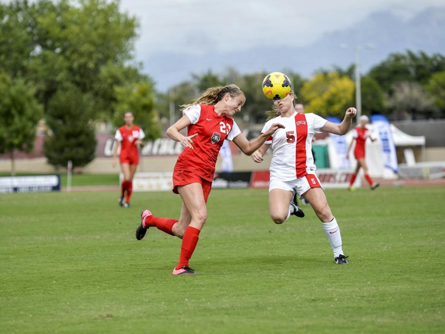 UNM midfielder Alyssa Coonrod headbutts a soccer ball on Oct. 10, 2015 against a University of Nevada Las Vegas player. This year, 2017, marks 25 years of women?s soccer history at UNM.