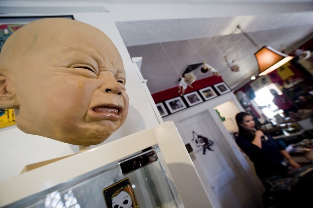 	Artwork pieces, like the one seen in this photo, are found at Cellar Door Gifts and Gallery. Owner Jessica Duverneay said she prefers to sell creepy art instead of mainstream pieces.