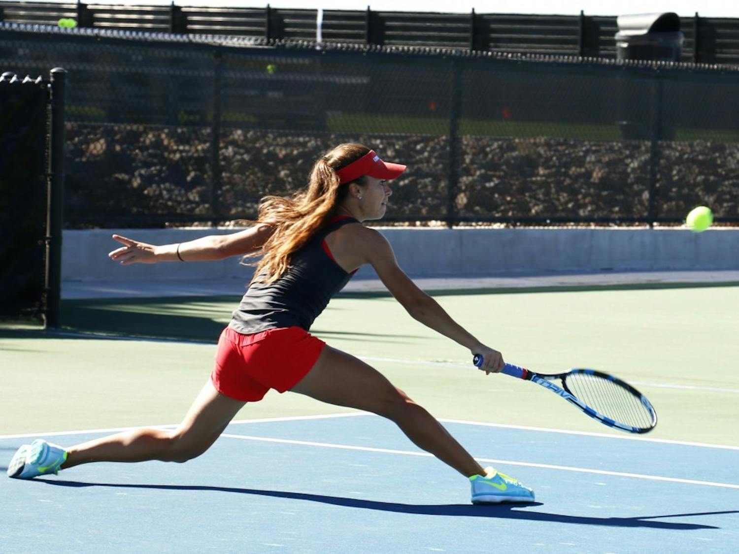 Sophomore Sharon Coone lunges for the ball against a UTEP player at the McKinnon Family Tennis Center Sunday Nov. 1. The Women's tennis team will return in the spring after not qualifying for the UTSA/ITA.