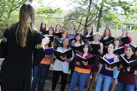 Instructor Maxine Thevenot leads a choir practice for Las Cantantes near the Center for the Arts on Tuesday. The group will perform on Friday at the Cathedral Church of St. John.
