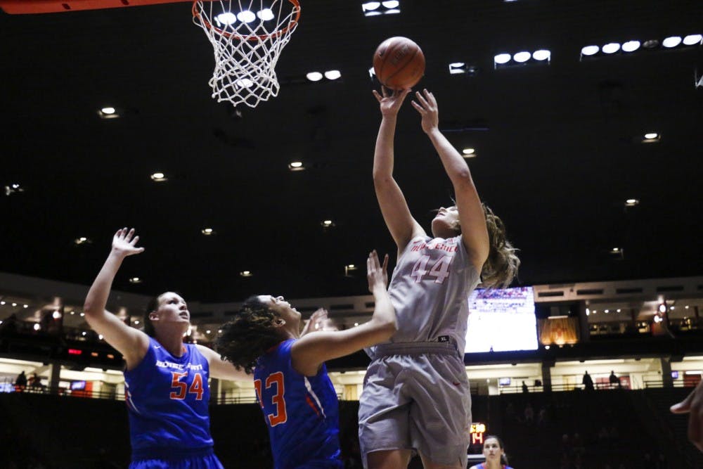 Sophomore center Jaisa Nunn reaches past Boise State defenses Tuesday, Jan. 18 at WisePies Arena.
