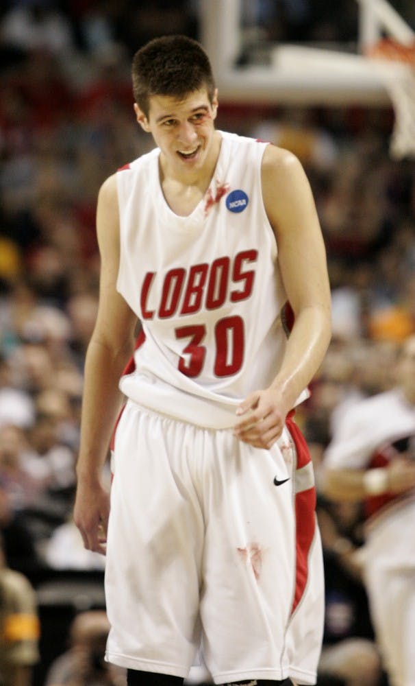 	Roman Martinez walks toward Huskies’ bench, his eye bloodied from a mid-air collision with an elbow. The Lobos watched their season end, as Washington pulled off an 82-64 win in the second round of the NCAA Tournament.