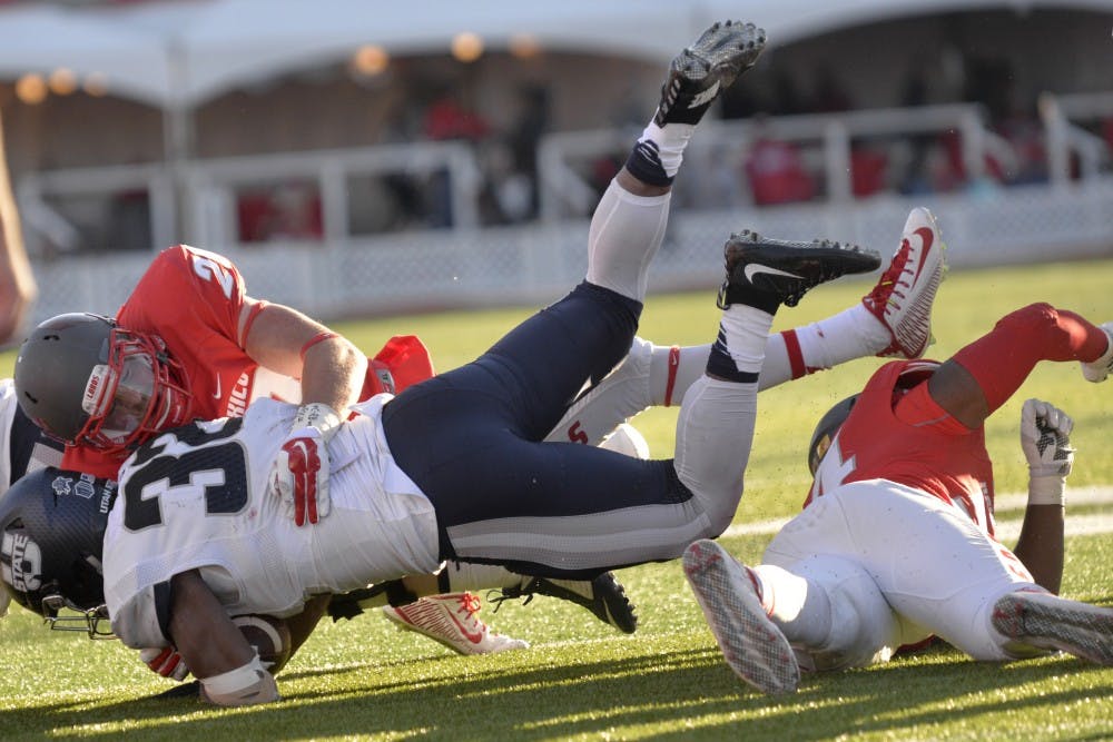 Senior linebacker Ryan Langford tackles a Utah State player at University Stadium Nov. 7. Langford&nbsp;received Mountain West Defensive Player of the week.