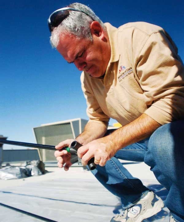 Michael Hattabaugh prepares to spend the week on Chick-Fil-A's roof at 3801 Ellison Drive on Monday to raise money for Carrie Tingley Hospital. 