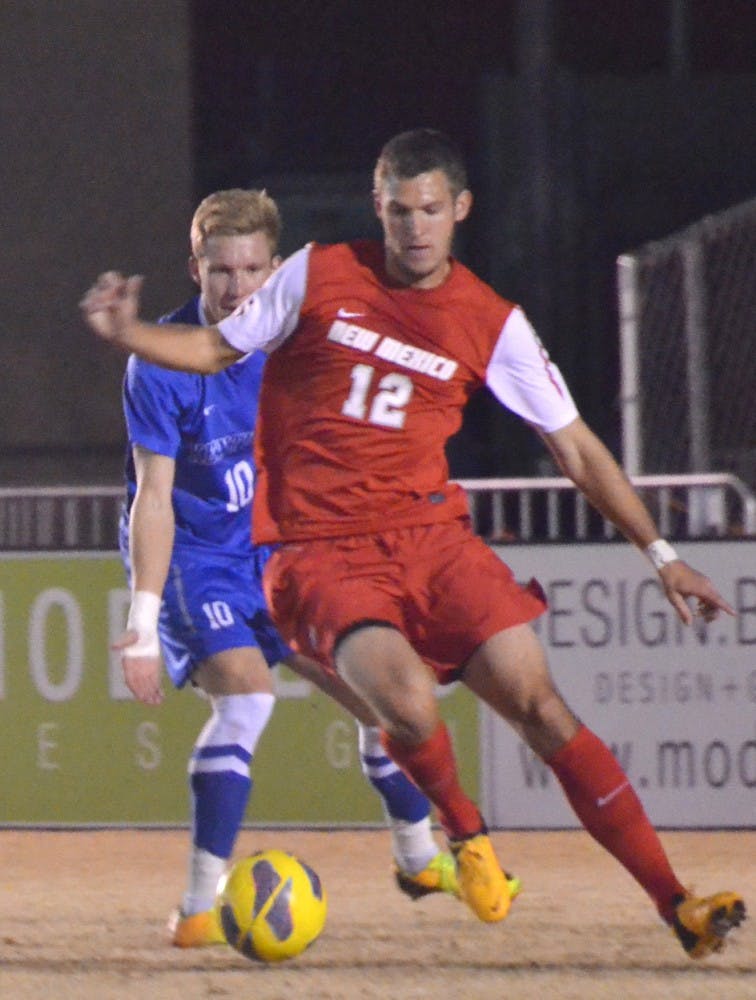 	Lobo defender Kyle Venter protects the ball from Kentucky forward Justin Laird during Saturday’s regular season finale at the UNM Soccer Complex. The Lobos hold the top seed for the Conference USA Tournament and will play Friday after a first-round bye. On Tuesday C-USA named Venter conference MVP.