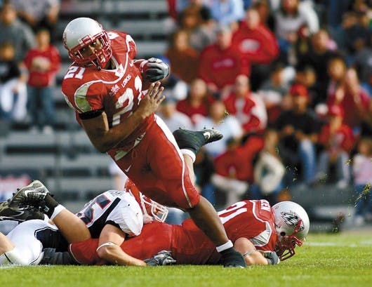 UNM tailback Rodney Ferguson cuts downfield during the 26-13 victory over UTEP at University Stadium on Saturday. Ferguson rushed for a career-high of 162 yards.