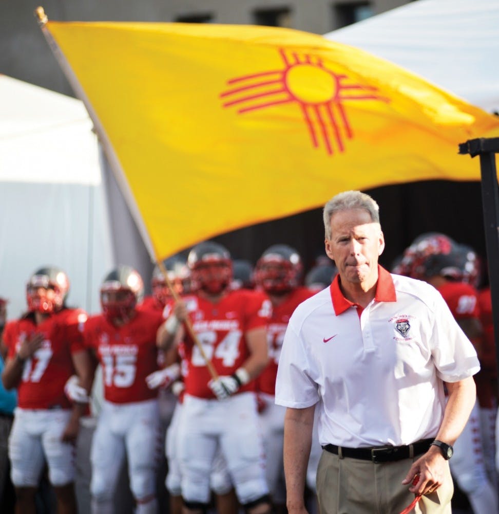 UNM's head football coach Bob Davie walks out onto Branch Field. Davie has agreed to a two-year extension with UNM that will last through 2021.