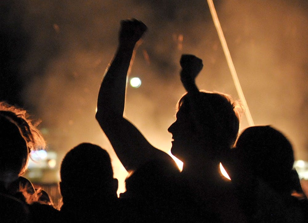	Students get pumped up during the Red Rally at Johnson Field on Thursday night. A large crowd of students and student-athletes gathered for the annual “Burning of the Aggie” before the Rio-Grande Rivalry football game at NMSU on Saturday. See page 8 for coverage.