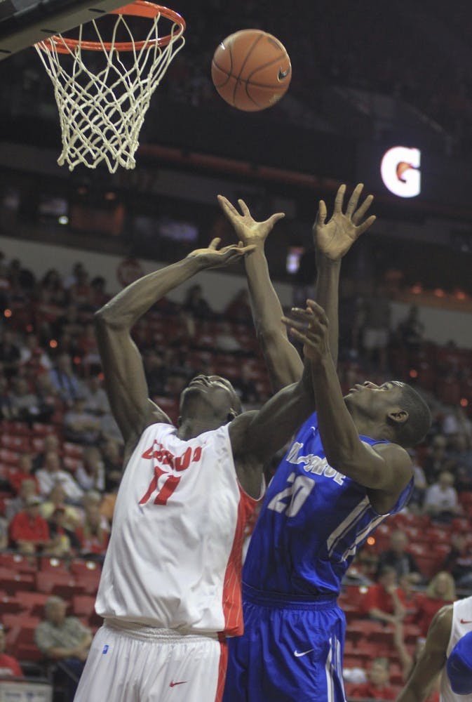 New Mexicos Obij Aget battles Air Forces Trevor Lyons for a rebound during a Mountain West Basketball Championship first-round game Wednesday afternoon at the Thomas & Mack Center in Las Vegas, Nevada.