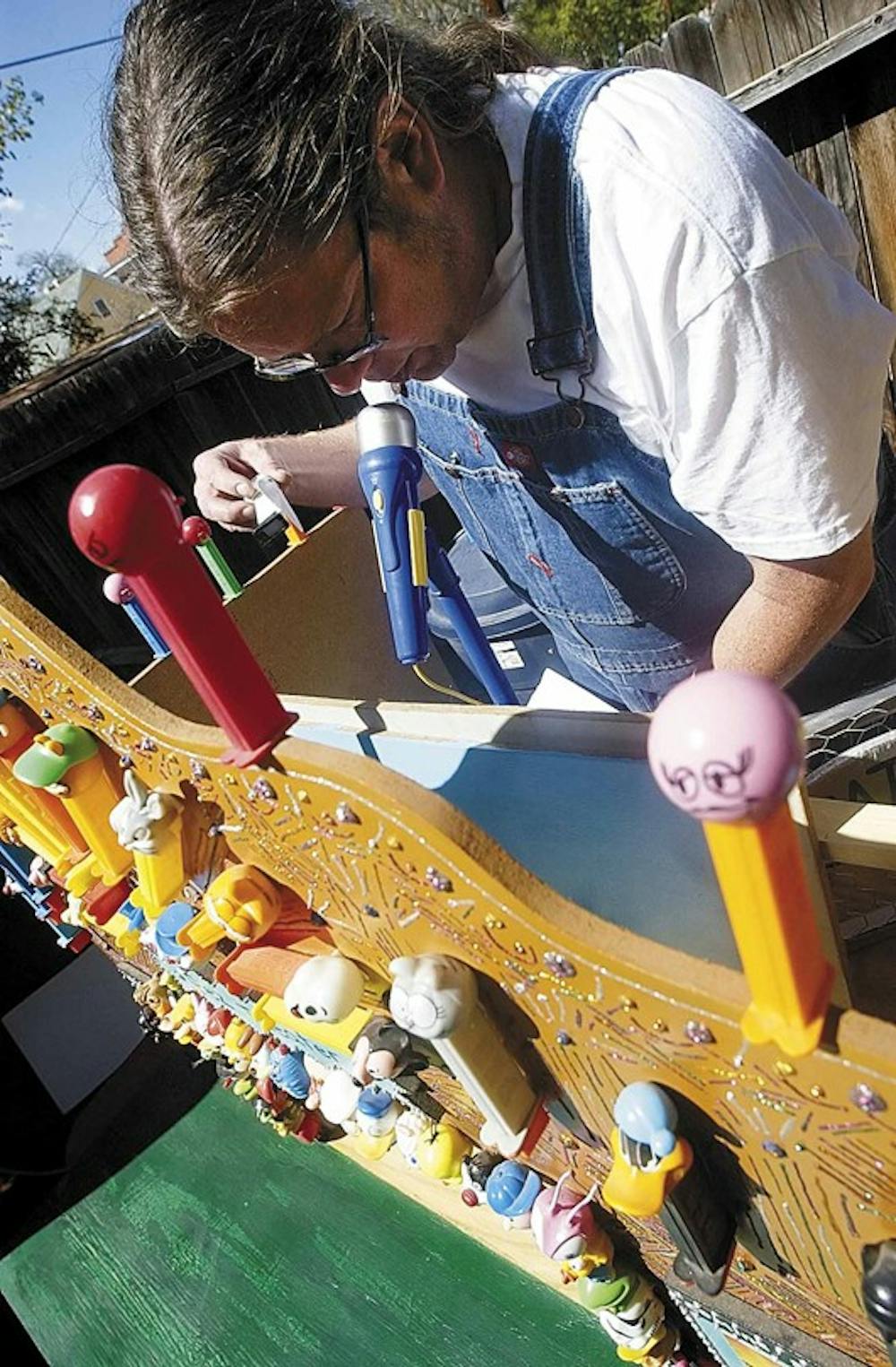 Artist Steve White performs a show in his Pez Theater with candy dispensers at his home Monday. 