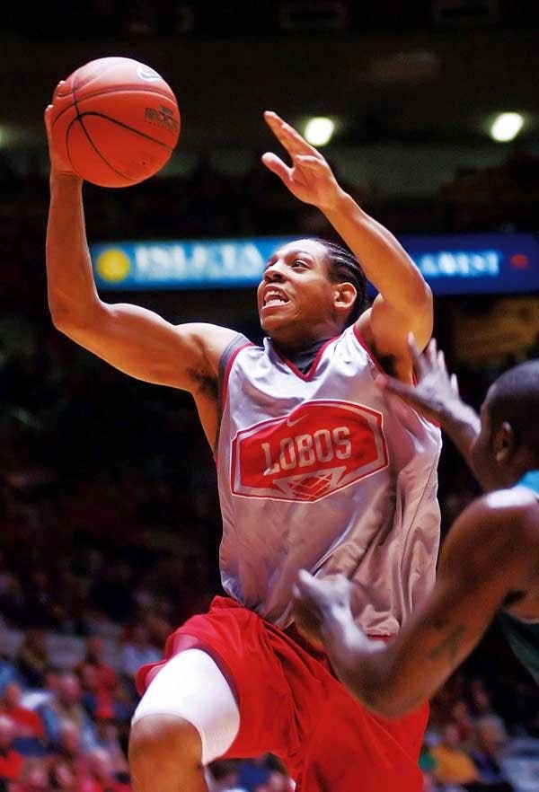 UNM's Dairese Gary goes for a layup during an exhibition match against Eastern New Mexico on Friday at The Pit. The Lobos won 94-50. 