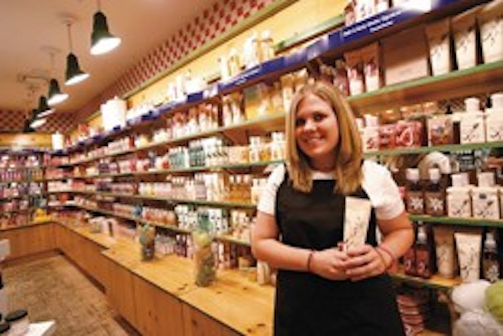 UNM student Katie Norris waits to greet customers at her summer job at Bath & Body Works in Winrock Mall on Tuesday. 