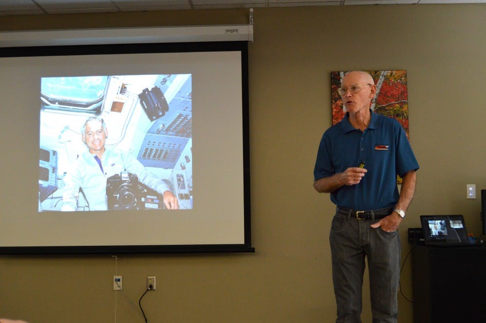 Mike Mullane speaks to students at the Student Health Center plaza Thursday afternoon about his life experiences on becoming an astronaut. Mullane became a mission specialist for the first group of space shuttle astronauts.