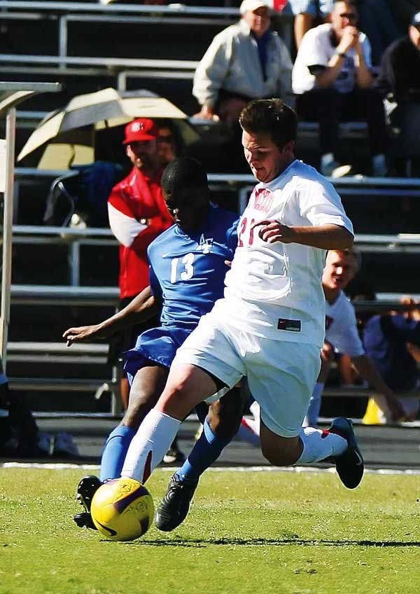 UNM forward Gardner Morrow fights for the ball with Air Force's Marc Charles during Sunday's game at the UNM Soccer Complex. The Lobos won 6-0. 
