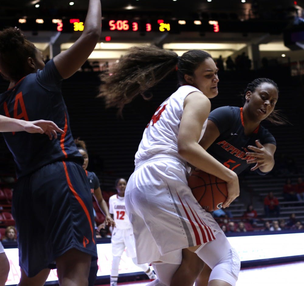 Freshman center Jaisa Nunn fights for the ball against a Pepperdine player at WisePies Arena Dec. 12. The Lobos beat Minnesota 72-53 on Wednesday.&nbsp;
