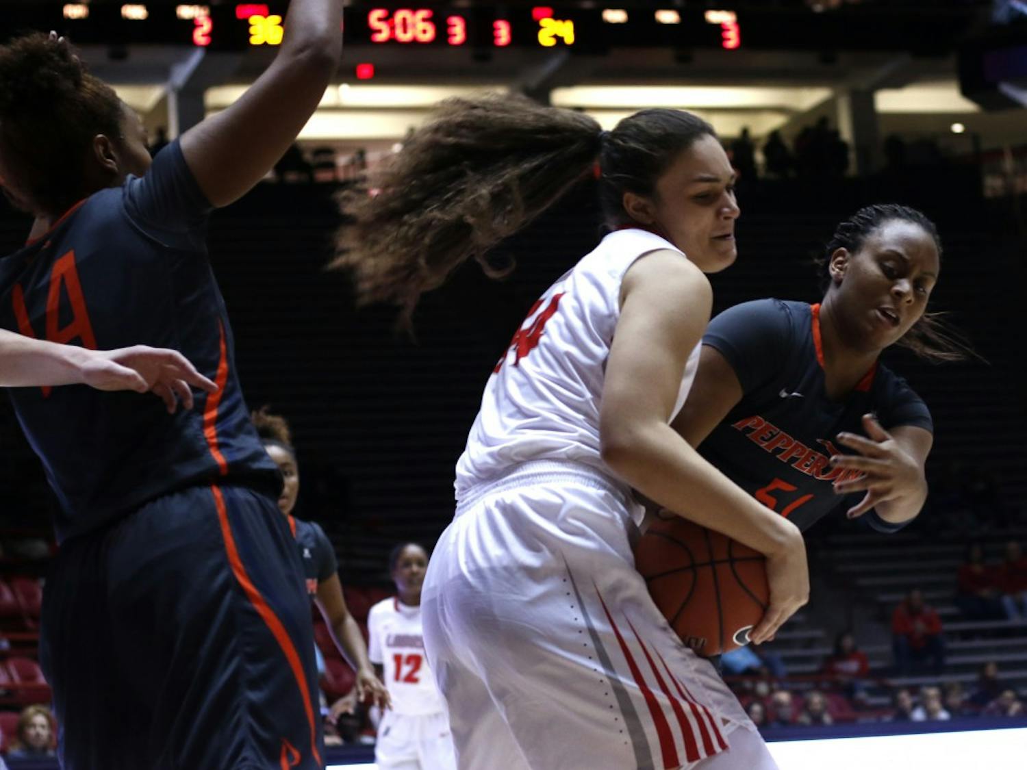 Freshman center Jaisa Nunn fights for the ball against a Pepperdine player at WisePies Arena Dec. 12. The Lobos beat Minnesota 72-53 on Wednesday.&nbsp;