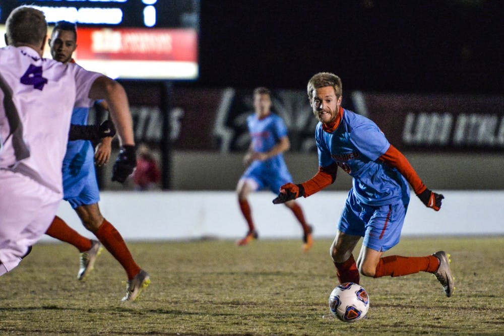 Redshirt senior midfielder Chris Wehan runs downfield during the Lobos match against University of Portland Thursday, Nov. 17, 2016 at the UNM Soccer Complex. The Lobos will play against Washington University for their second round game for the NCAA Tournament.&nbsp;
