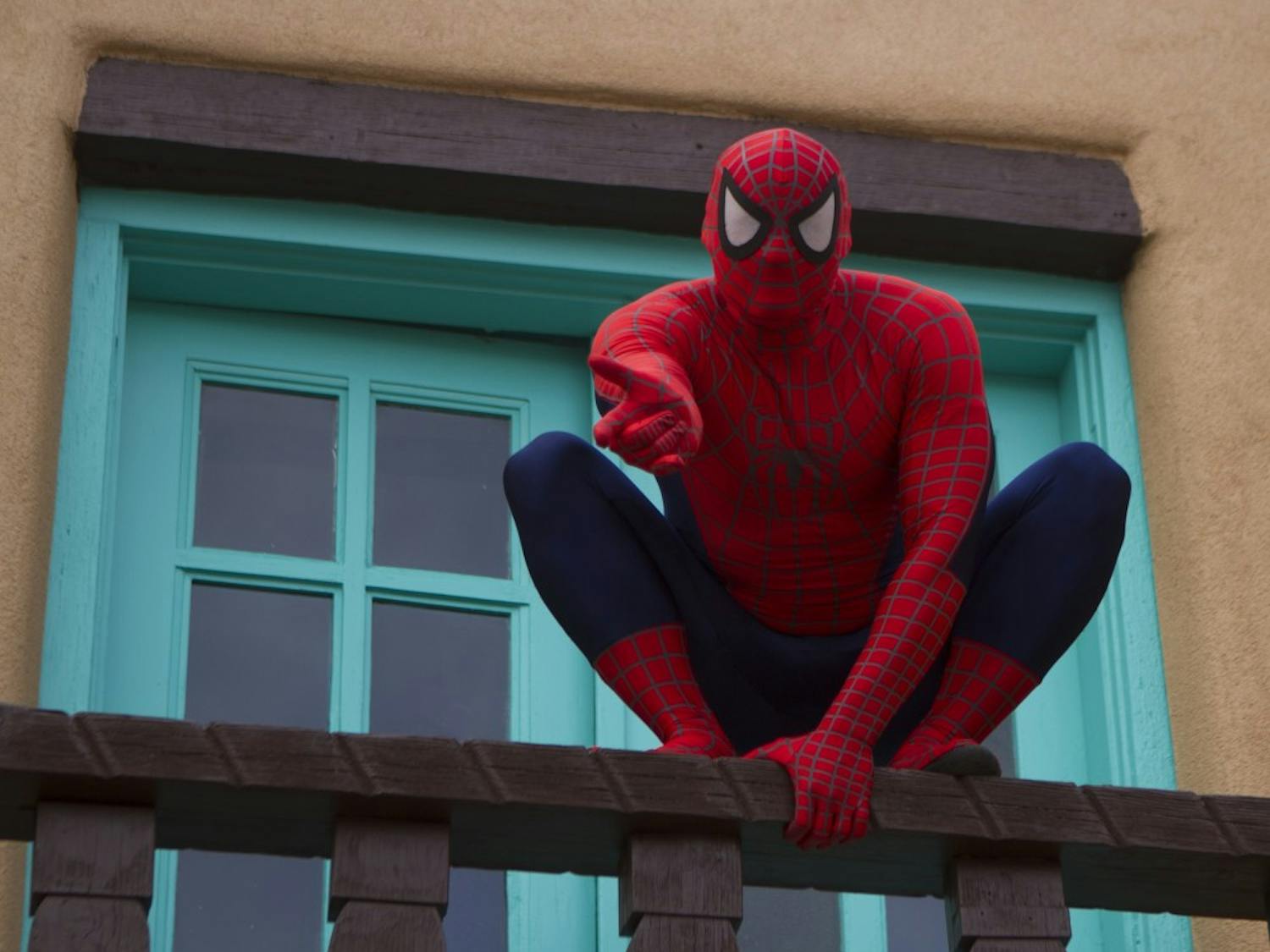 	The superhero known as Spider-Man readies to flee from UNM&#8217;s Marron Hall on Monday after halting a gang dispute that took place earlier in the day.