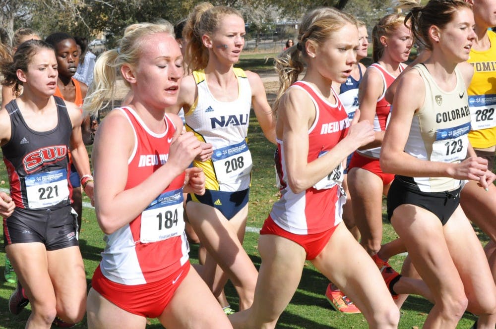 Callie Thackery (left) and Alice Wright set the pace for New Mexico during the NCAA Championships in Albuquerque, New Mexico on Nov. 14, 2014. Thackery and Wright will be running alongside one another again in the Wisconsin Adidas Invitational on Friday.