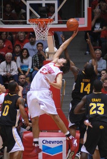 Daniel Faris corrals a rebound against Southern Mississippi on Saturday at The Pit. The Lobos erased an 11-point second-half lead to defeat the Golden Eagles 60-58.