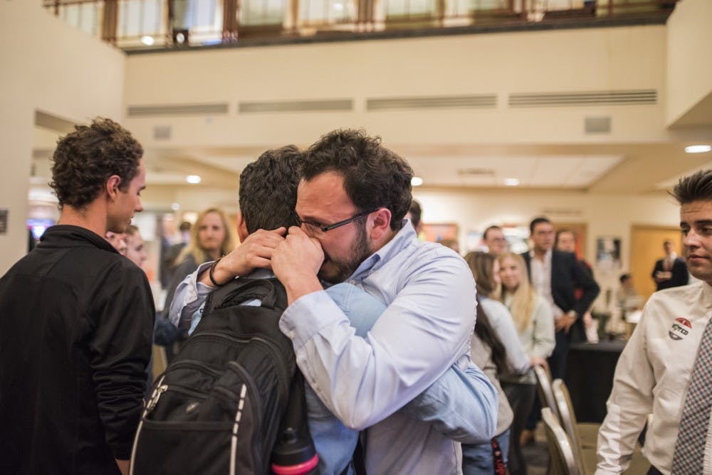 ASUNM Director of Communications Gabe Gallegos embraces a friend during his loss against Noah Brooks for ASUNM President on Wednesday, March 29, 2017 at the UNM SUB.