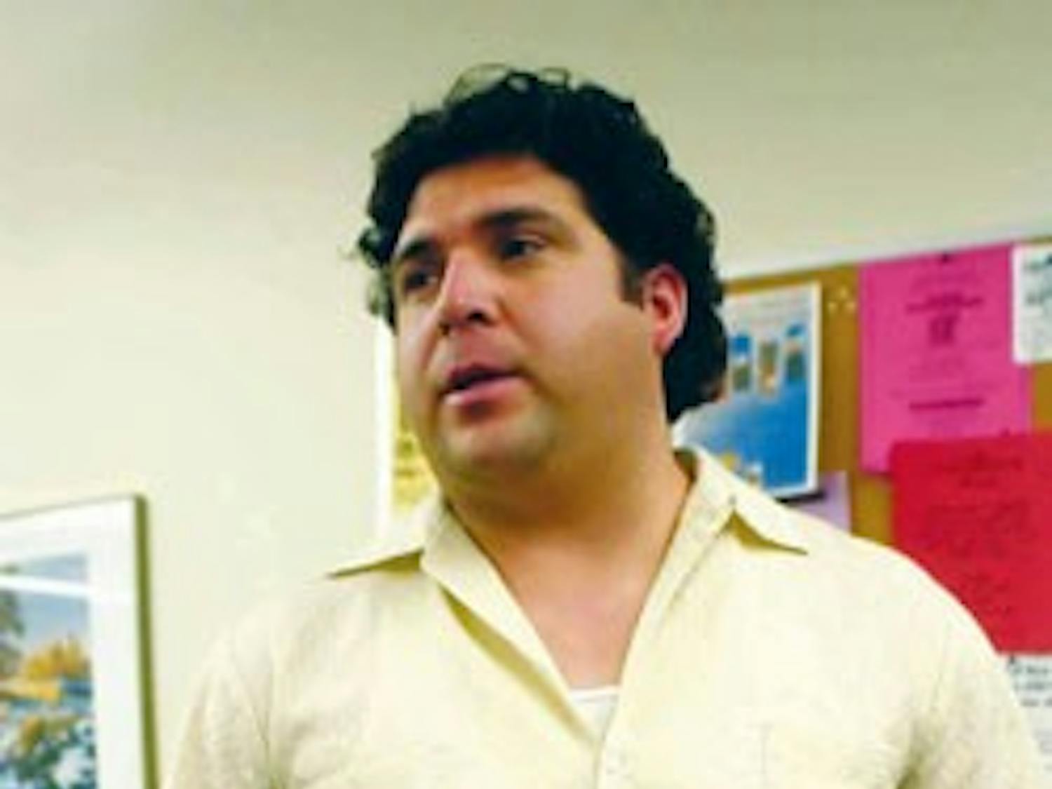 GPSA President Joseph Garcia talks to a reporter in the SUB on Sunday about his plans to run for Albuquerque City Council in October.