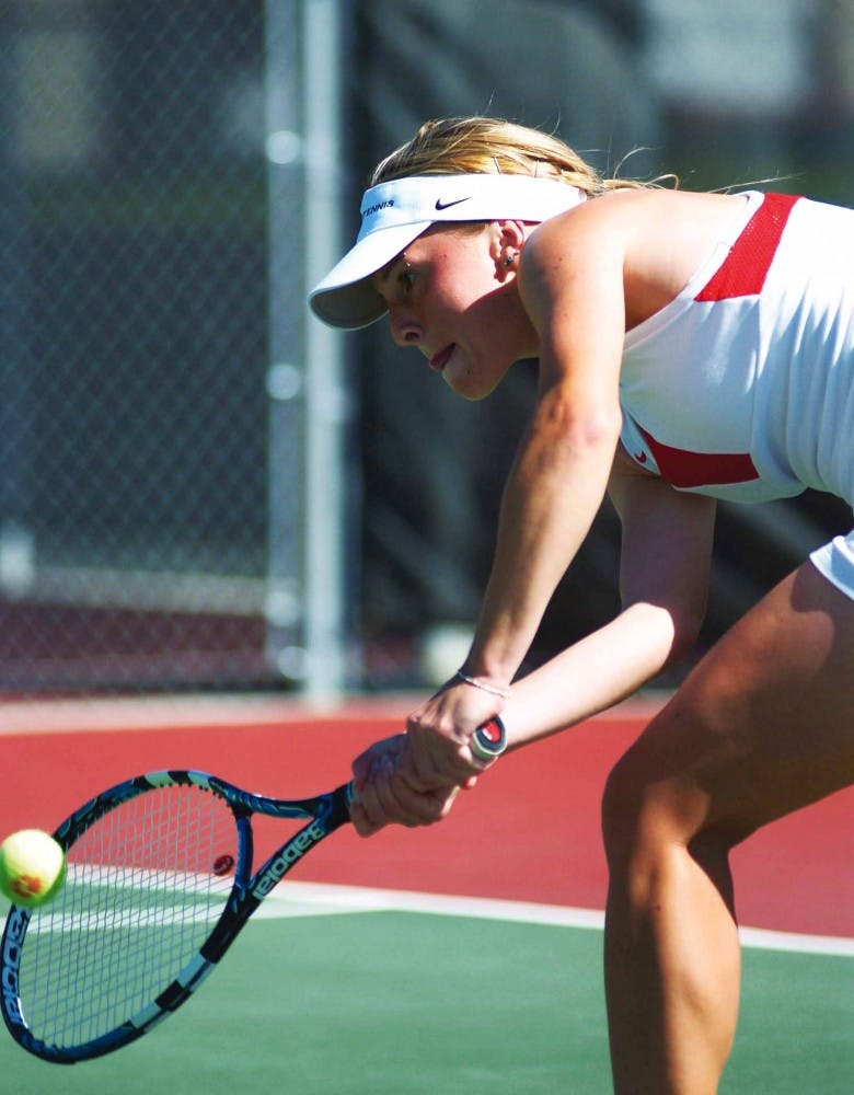 UNM's Sandra Zmak returns the ball during Saturday's match against Air Force Academy at the UNM Tennis Complex. The Lobos won 7-0.