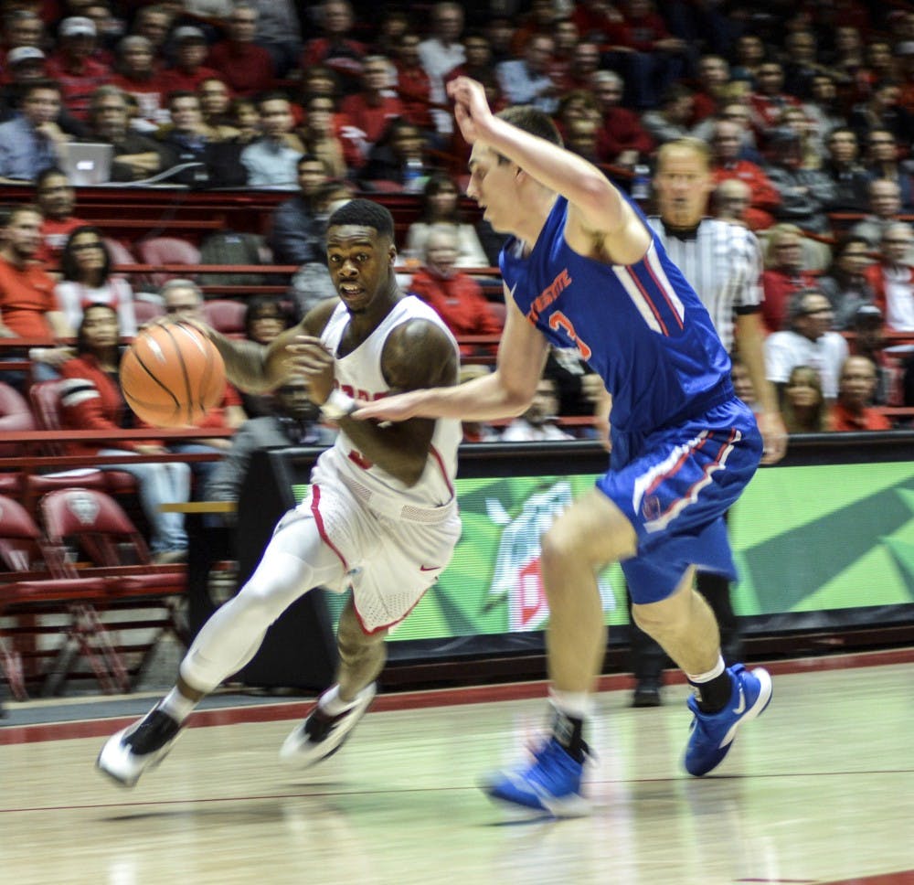 Antino Jackson of New Mexico drives against Justinian Jessup, No. 3, of Boise State during the second half of Tuesday night's game at Dreamstyle Arena. The Lobos gave up a late lead and lost 73-71.
