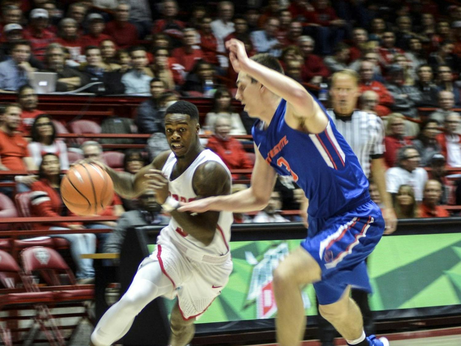 Antino Jackson of New Mexico drives against Justinian Jessup, No. 3, of Boise State during the second half of Tuesday night's game at Dreamstyle Arena. The Lobos gave up a late lead and lost 73-71.
