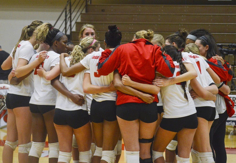 The Lobo Volleyball team huddles together after its game against Colorado State at Johnson Gym on Thursday night. The Lobos lost to Colorado State 0-3.