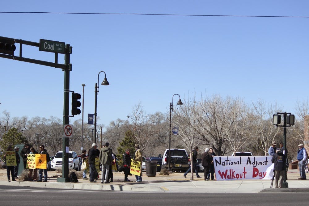 Education professionals gather on the corner of Coal Avenue and University Boulevard on Wednesday morning for National Adjunct Walkout Day. The nationwide event aims to bring individuals together to insist on fair wages and better working conditions for part-time teachers. 