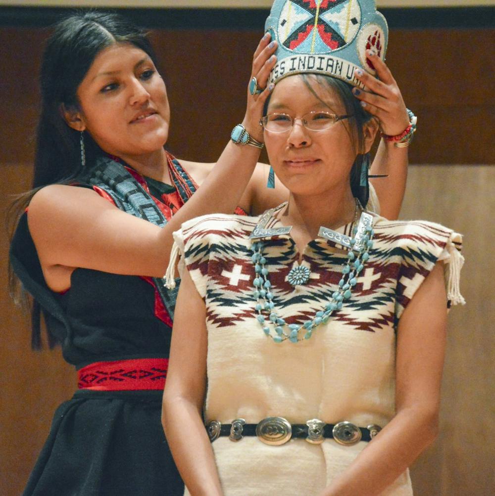 Renata Yazzie is crowned the new Miss Indian UNM 2015-16 by Melodie Cruz on Friday at Keller Hall. Yazzie serves as an ambassador for the Native american population within the University. 