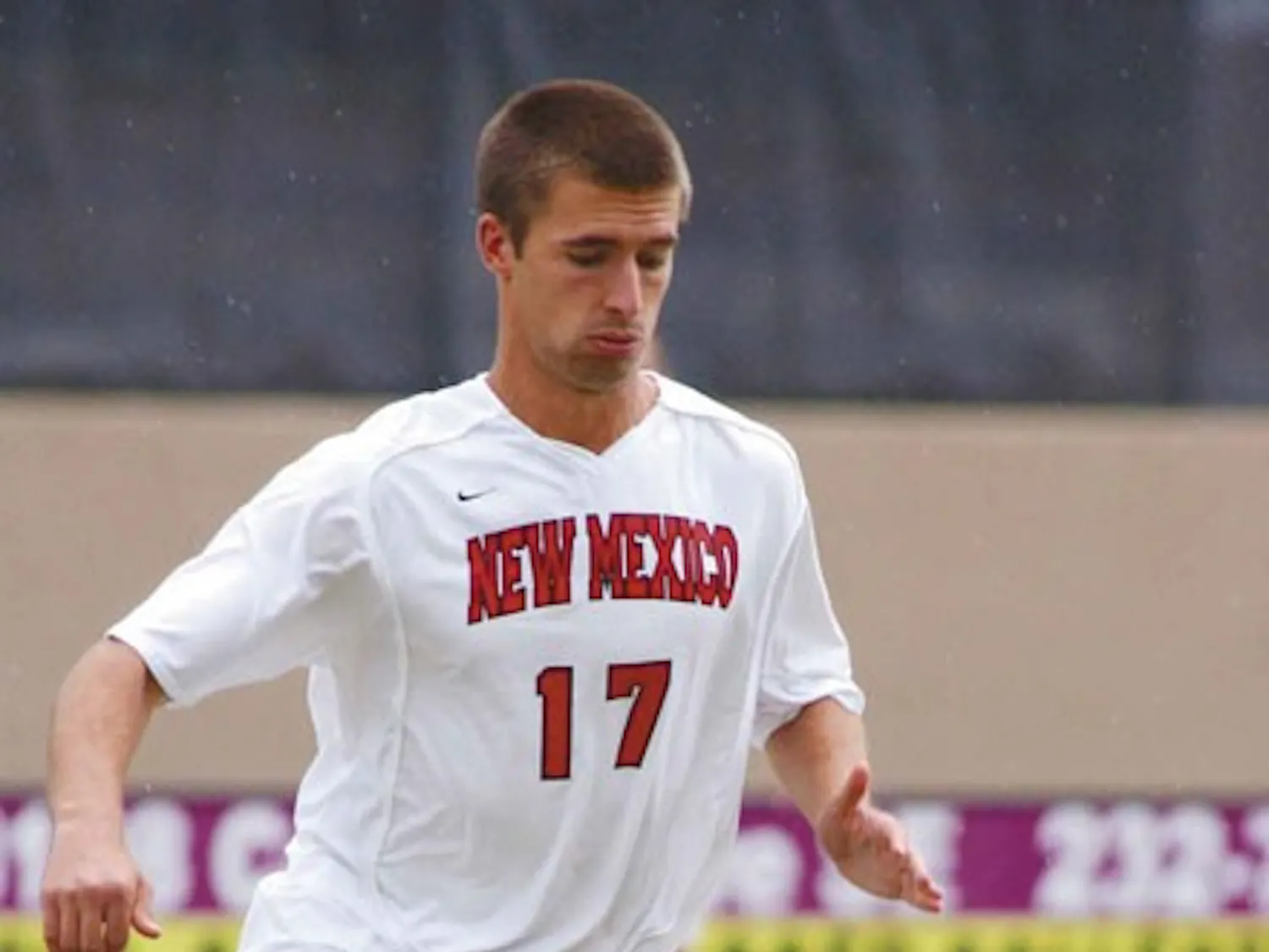 Lobo sophomore Mike Porter dribbles downfield during a game at the UNM Soccer Complex.