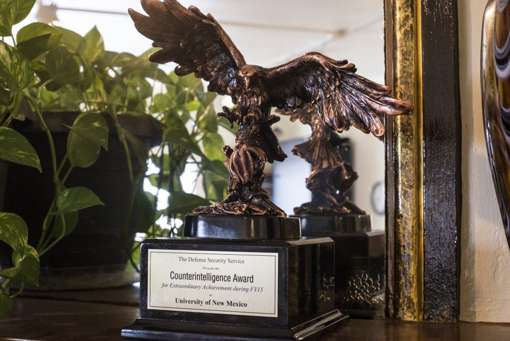 A counterintelligence award sits in Deborah Kuidis’ office Friday afternoon. The award was given to a team which Kuidis led that trained UNM staff and faculty on counterintelligence techniques.