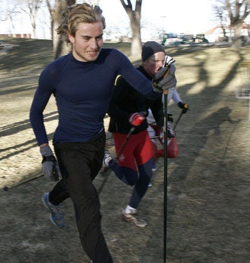 Casey Dyck, left, and Tor-Hakon Hellebostad practice with the UNM ski team on Jan. 29 at Roosevelt Park.