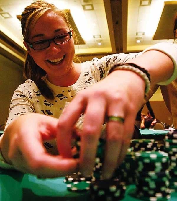 Student AJ Patton stacks her chips after winning a hand during Poker for Pups, a tournament sponsored by a class in the Anderson Schools of Management on Thursday in the SUB. The group raised more than $1,200, which will be donated to the Albuquerque Huma