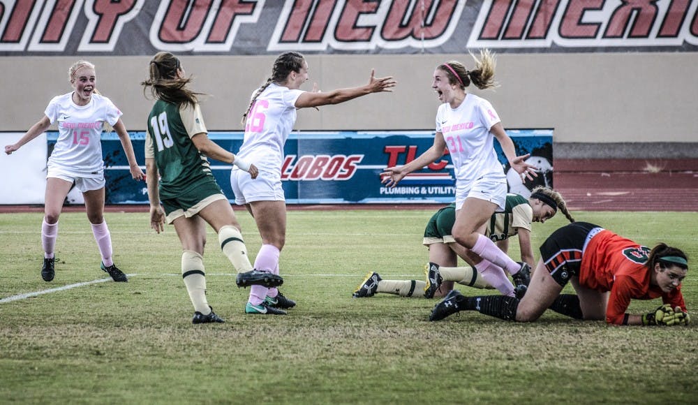 UNM forward and midfielder, Jenna Killman, left, prepares to embrace Aspen Headrick, after a goal against&nbsp;Colorado State University on Oct. 21, 2017. The Lobos defeated CSU 4-2.