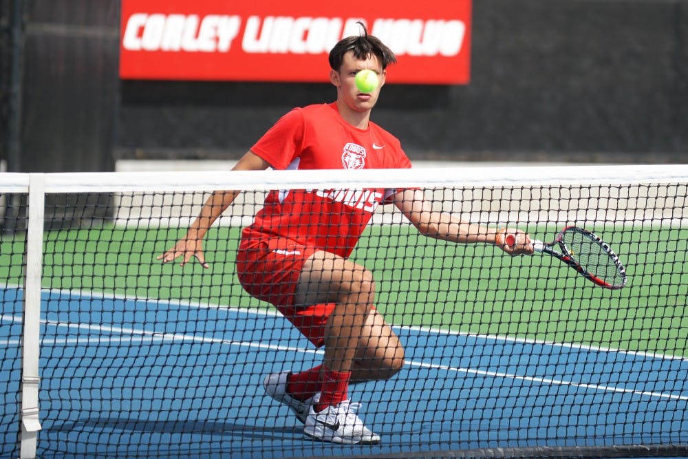 Freshman Ricky Hernandez-Tong stares down the ball after he hits it back to his opponent at the McKinnon Family Tennis Stadium. The Lobos will play in the Mountain-Pacific Invitational this upcoming weekend in Albuquerque.