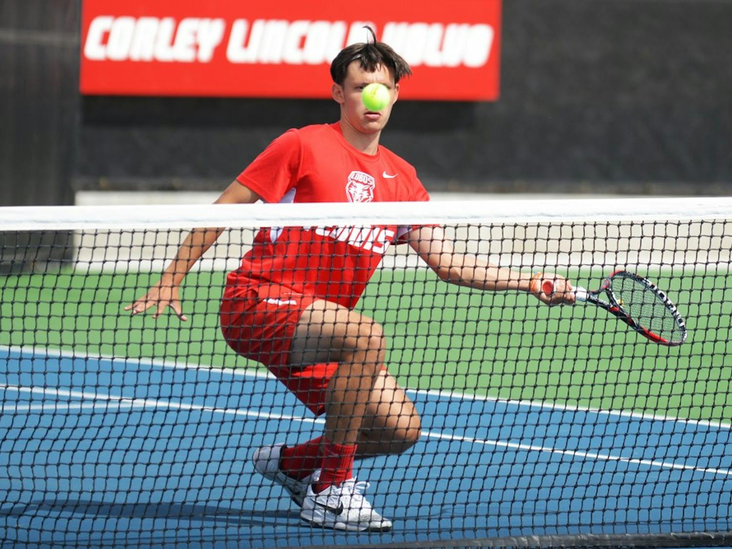 Freshman Ricky Hernandez-Tong stares down the ball after he hits it back to his opponent at the McKinnon Family Tennis Stadium. The Lobos will play in the Mountain-Pacific Invitational this upcoming weekend in Albuquerque.