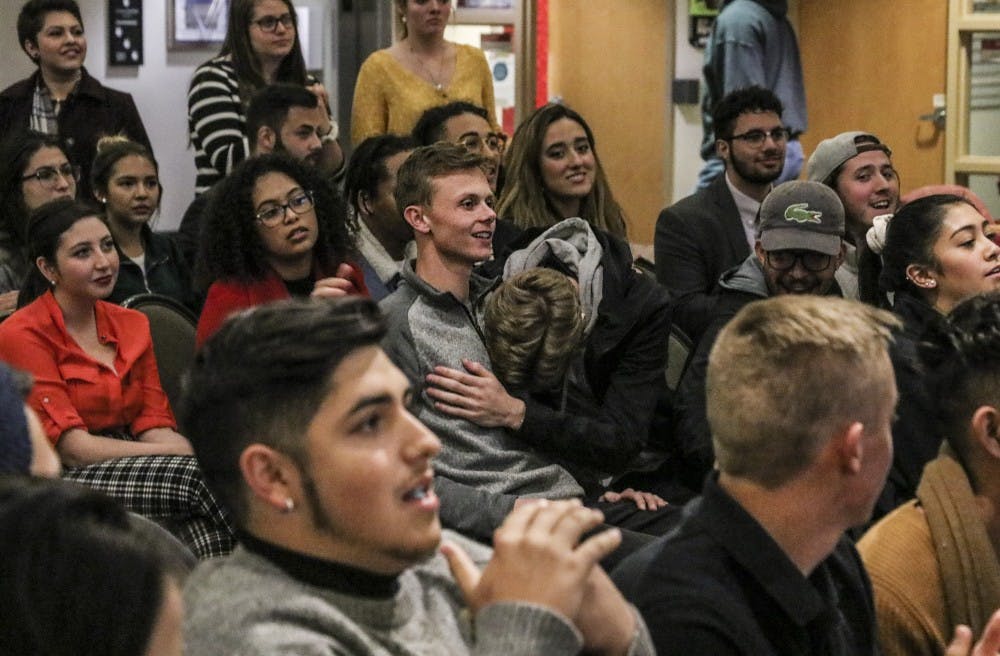 Daniel Stearns embraces Elijah Jaffe as their names are announced during the ASUNM Senate Election results meeting in the SUB on the evening of Nov. 14.