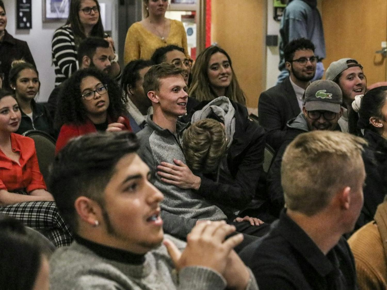 Daniel Stearns embraces Elijah Jaffe as their names are announced during the ASUNM Senate Election results meeting in the SUB on the evening of Nov. 14.