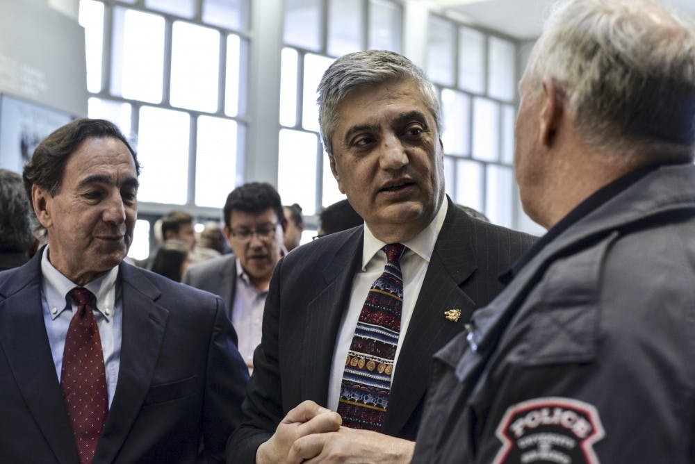 President Chaouki Abdallah greets Chief of UNMPD Kevin McCabe at his farewell reception on Feb. 26, 2018 at Popejoy Lobby.