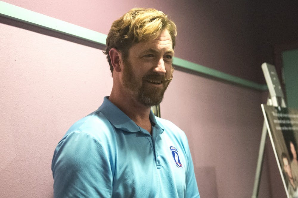 	Eric Ortegren discusses his military experience at High Ridge 8 movie theater Friday night. Ortegren told the audience how his time served was similar to what was portrayed in the Korenegal film.