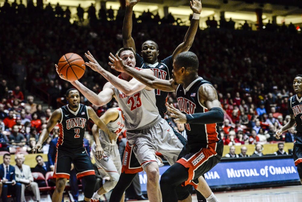Junior forward Joe Furstinger prepares to send a pass while guarded Tuesday, Jan. 10, 2017 at WisePies Arena. The Lobos will host Wyoming University Saturday night with hopes to win their third straight victory.&nbsp;