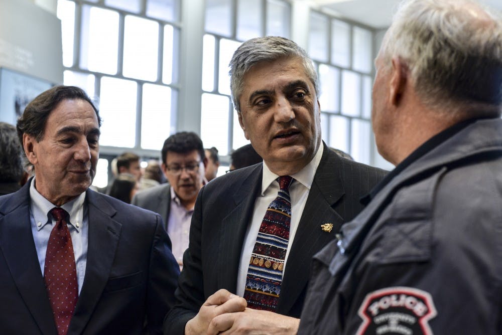 President Chaouki Abdallah greets Chief of UNMPD Kevin McCabe at his farewell reception on Feb. 26, 2018 at Popejoy Lobby.
