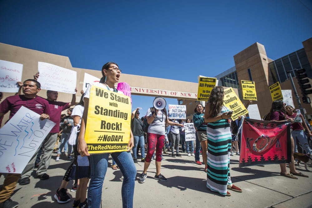 Protestors chant in front of the UNM Bookstore as part of a protest against the Dakota Access Pipeline.&nbsp;